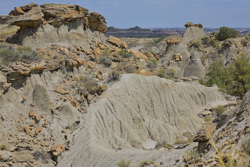 A collection of fallen capstones and a cool serpentine like mound under still in tact hoodoos.